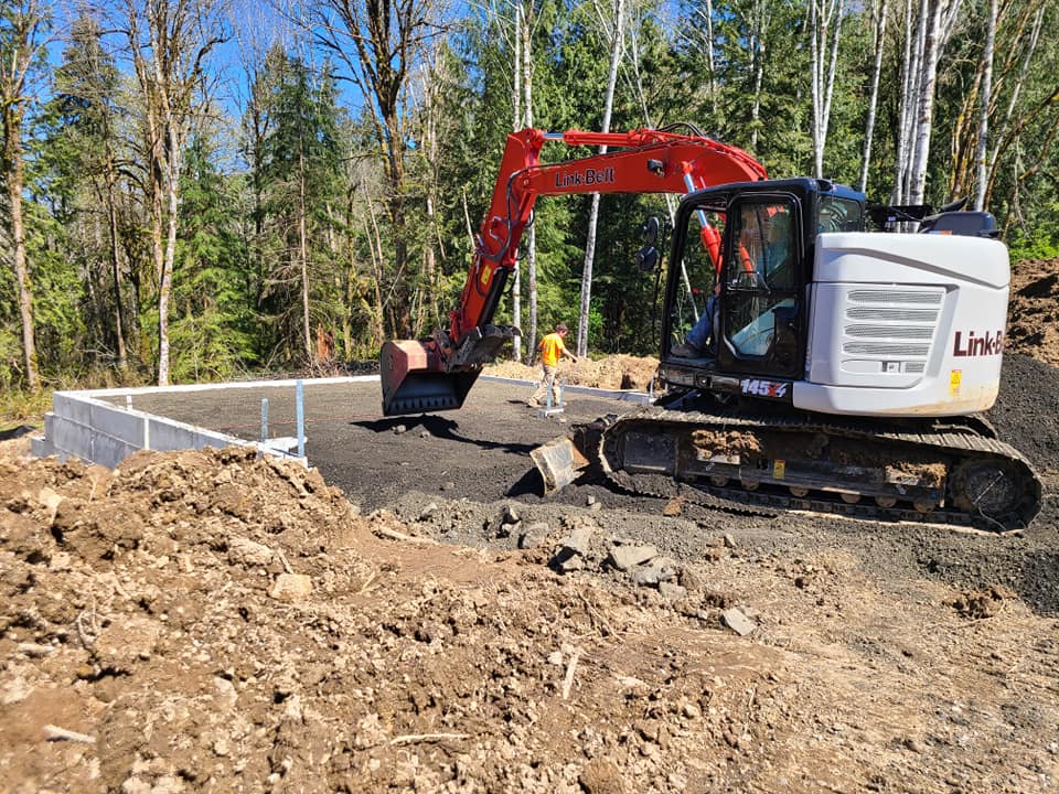 Swick and son excavator work at a custom home building project